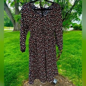 Hearts on dress, v neck with tie back and ruffles. Sweet!